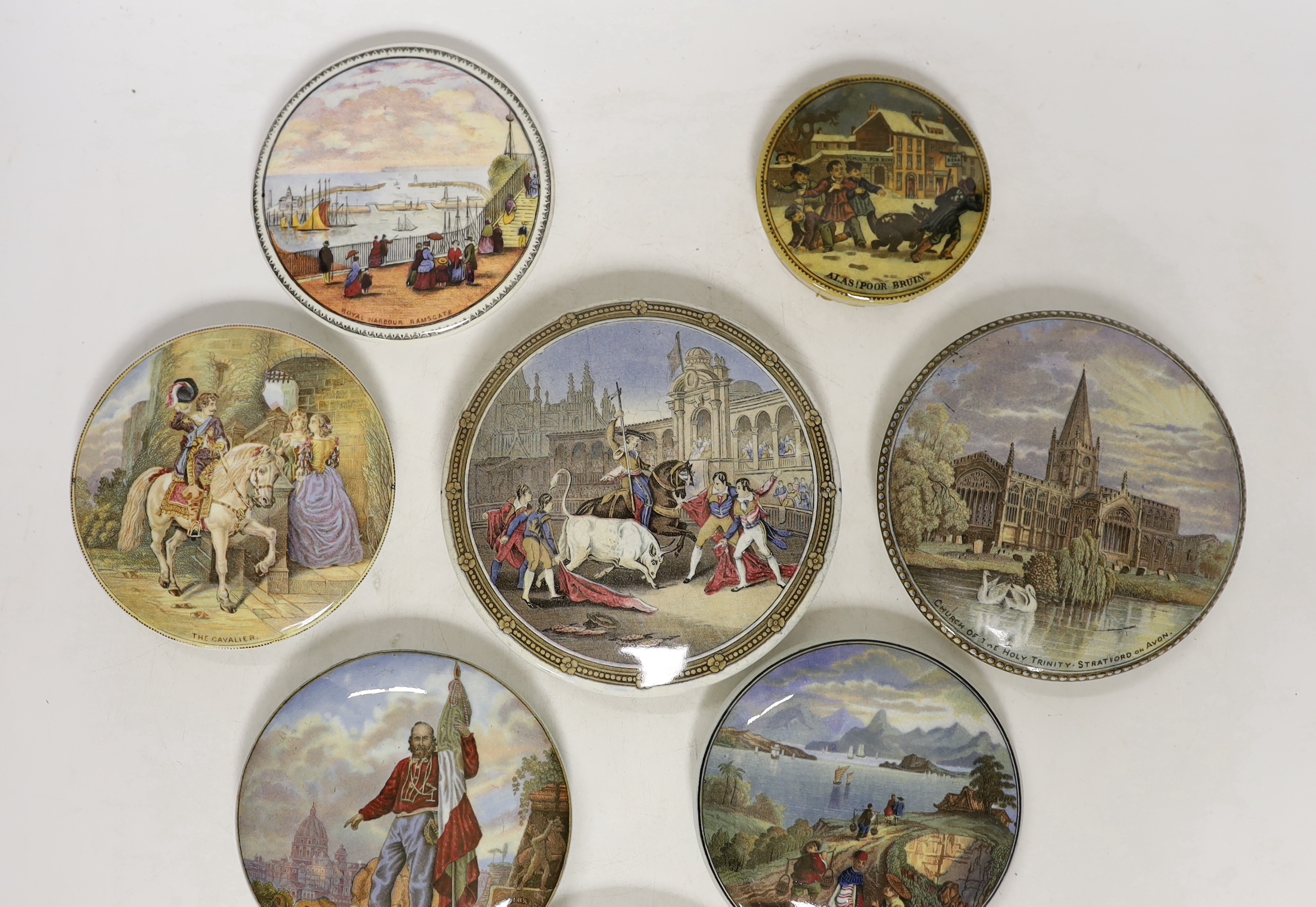 Eight Victorian ceramic Prattware pot lids, including ‘Alas Poor Bruin’ scene with bear, largest 13cm